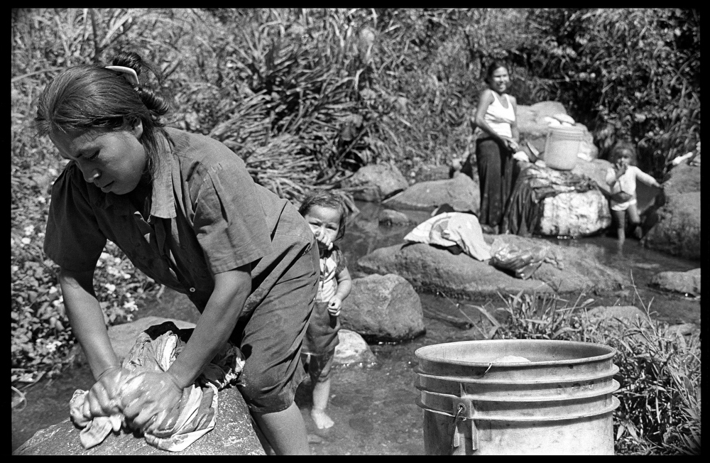 Women doing laundry in the Yasica River.