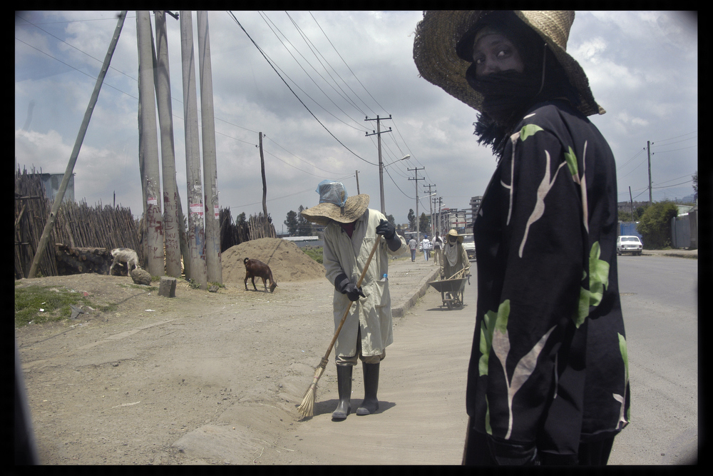 Women work as street sweeps cleaning the streets of Addis Ababa. 